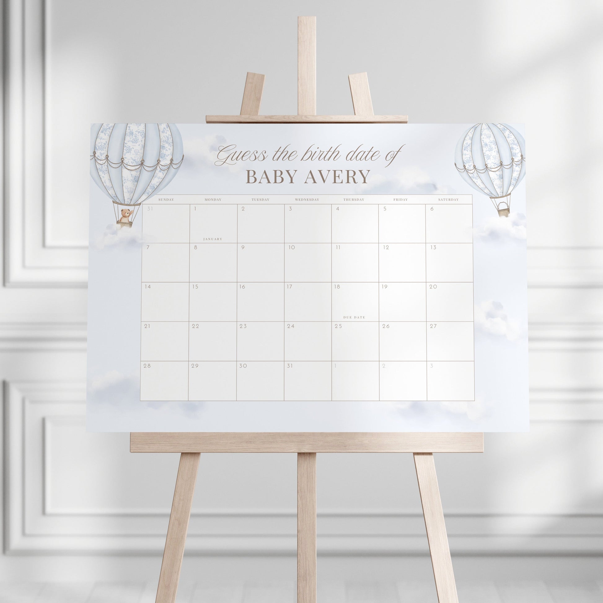 Guess the Birth Date Calendar on a stand against a white wall