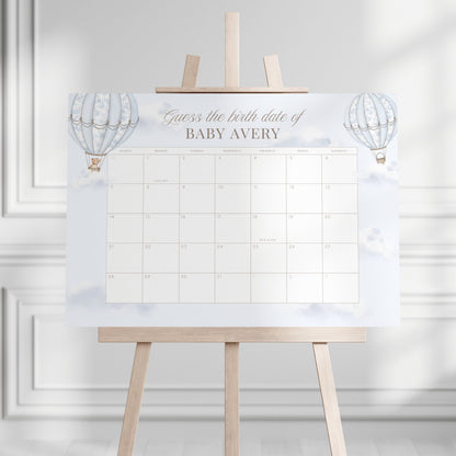 Guess the Birth Date Calendar on a stand against a white wall