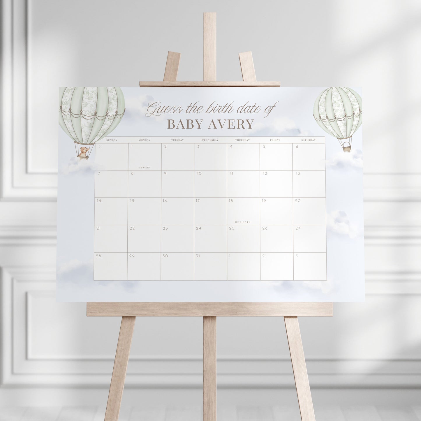 Guess the Birth Date Calendar on an easel against a white wall.