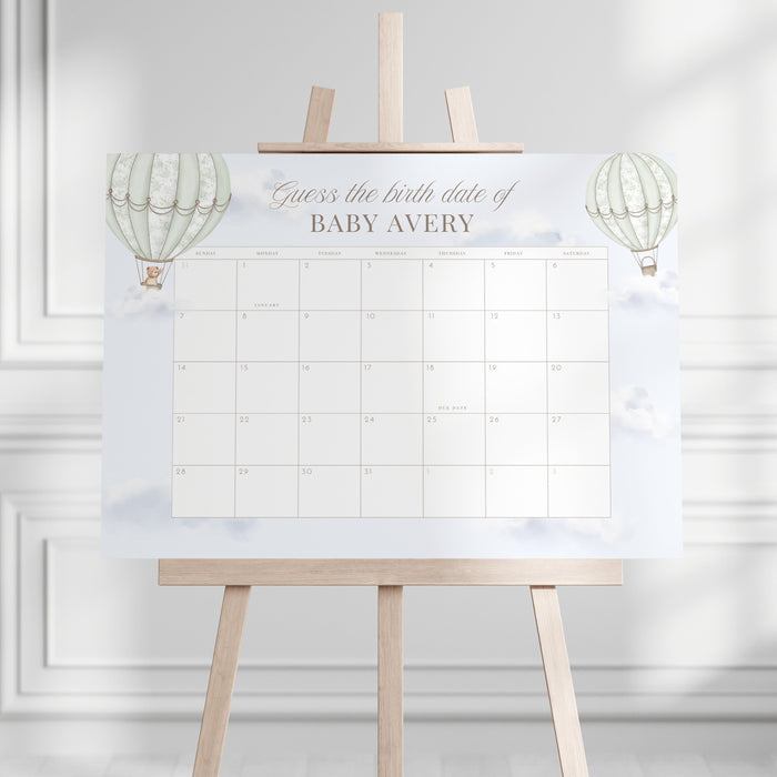 Due Date Calendar with baby milestone markers on a stand against a white wall.