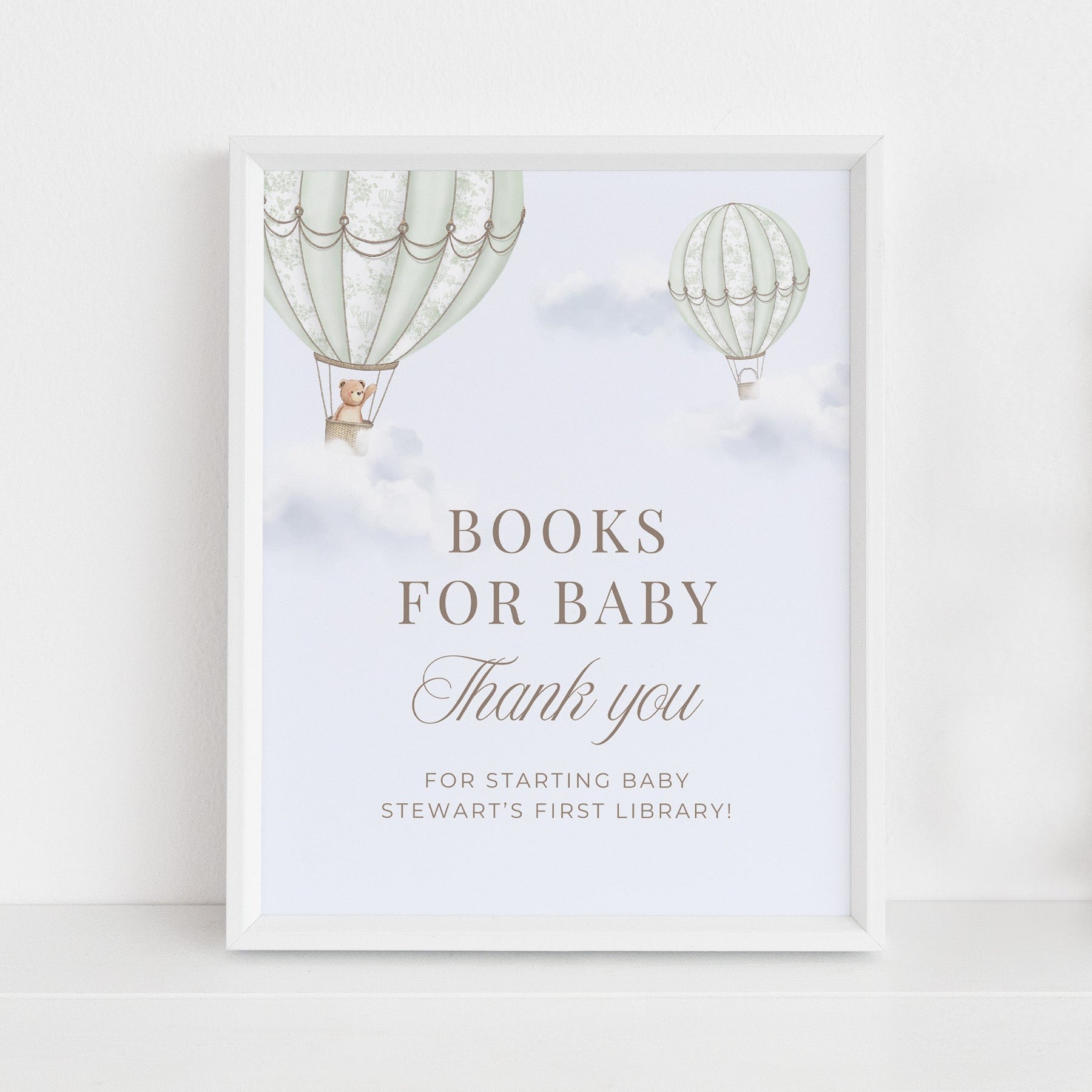 Framed Table Sign with hot air balloons and text on a white wall