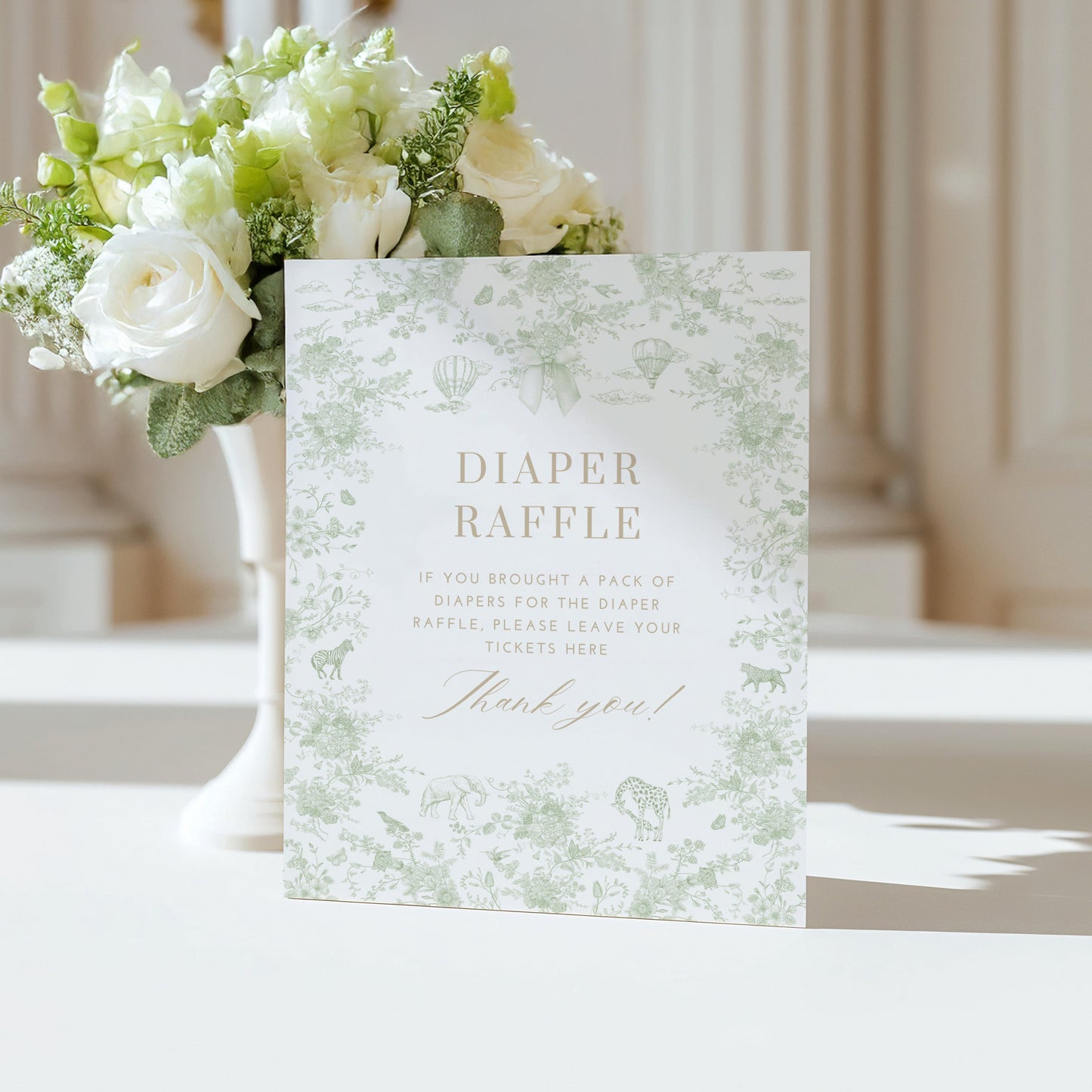 Table Sign with sage green floral design on a white surface
