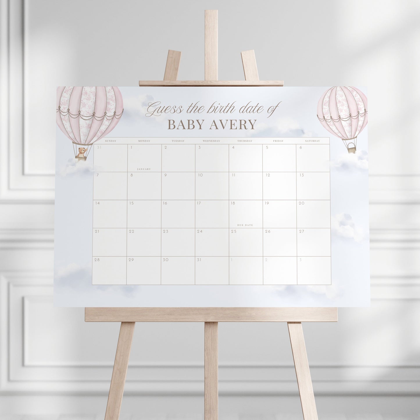 Guess the birth date calendar on an easel against a white wall