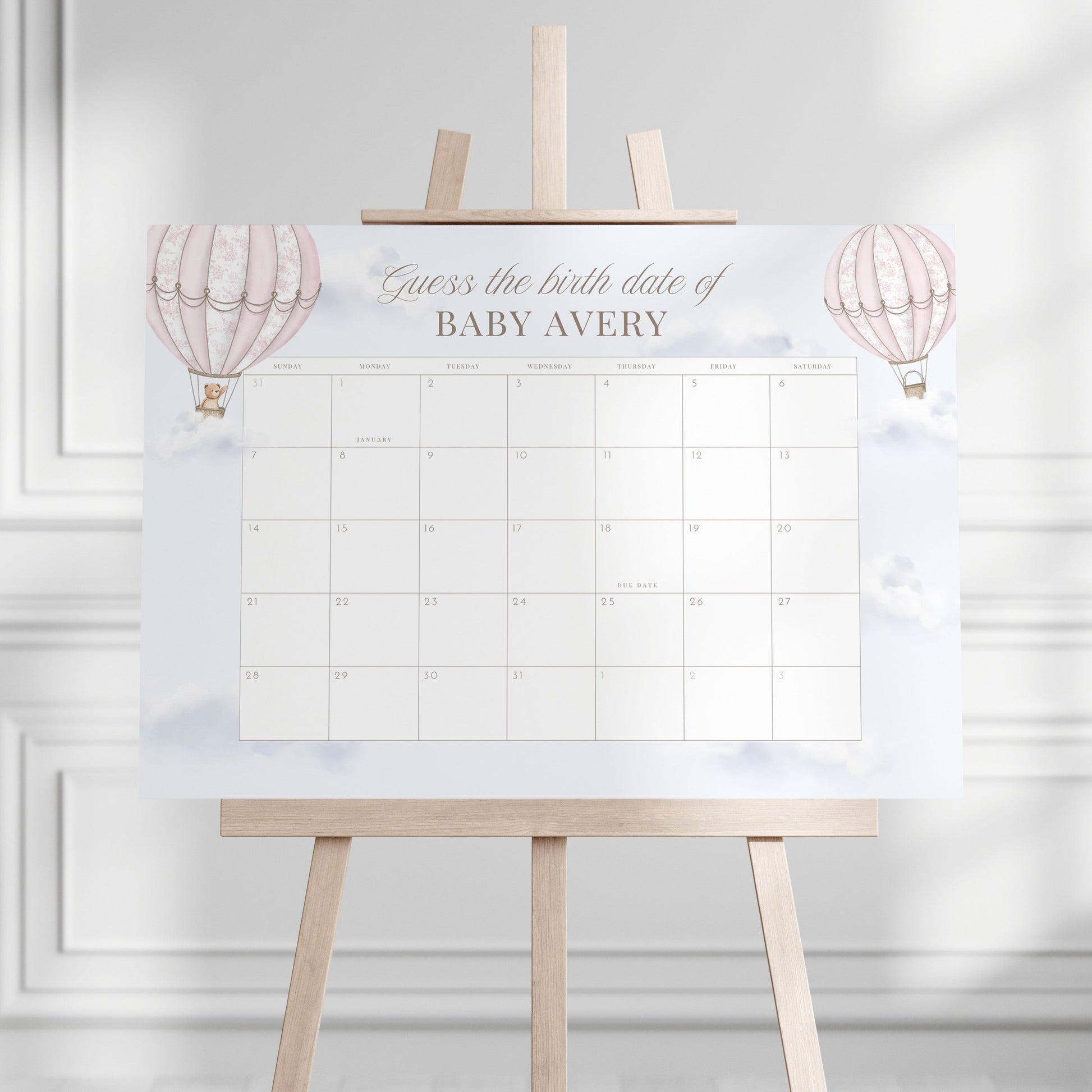 Guess the birth date calendar on an easel against a white wall