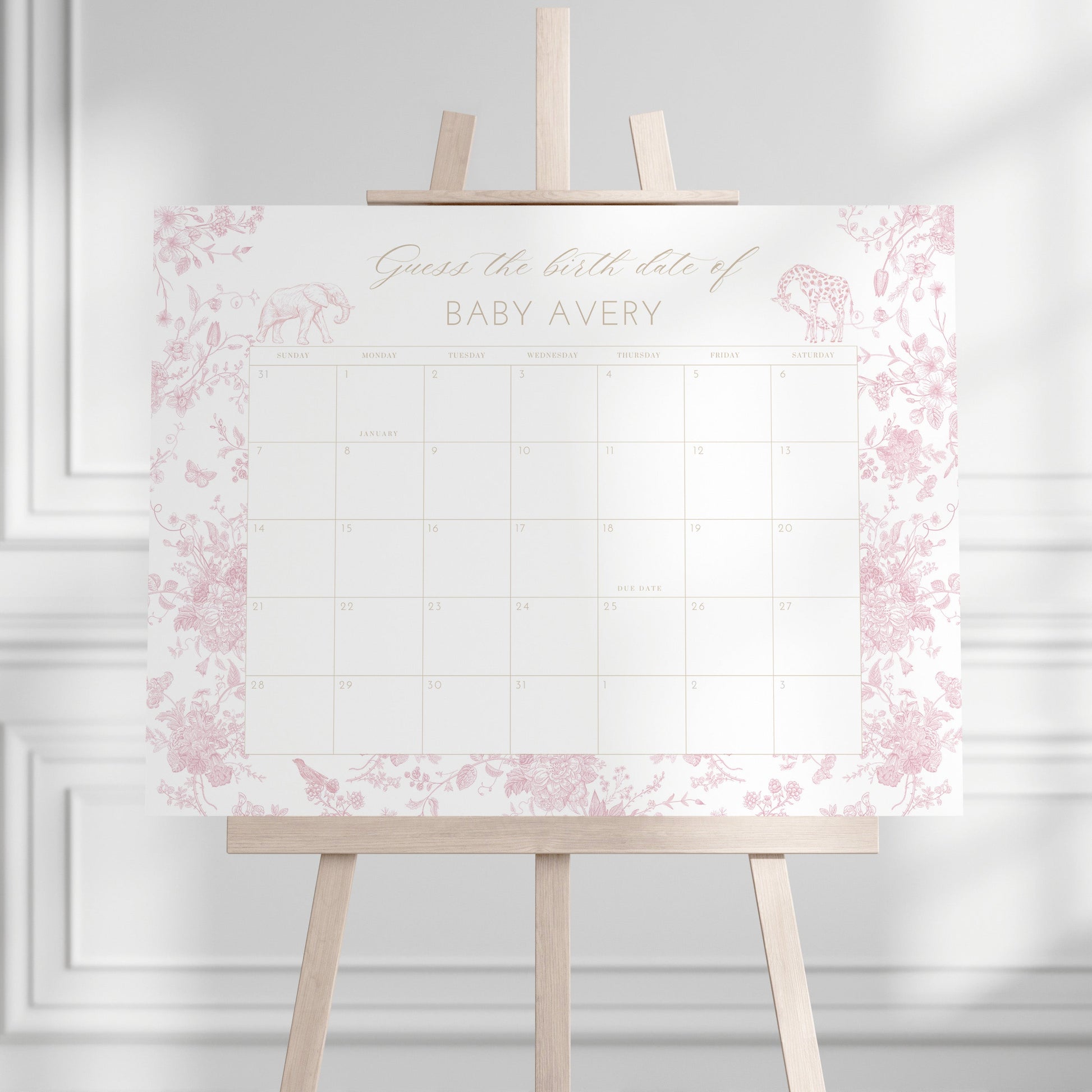 Guess the Birth Date Calendar with pink floral design on an easel against a white wall
