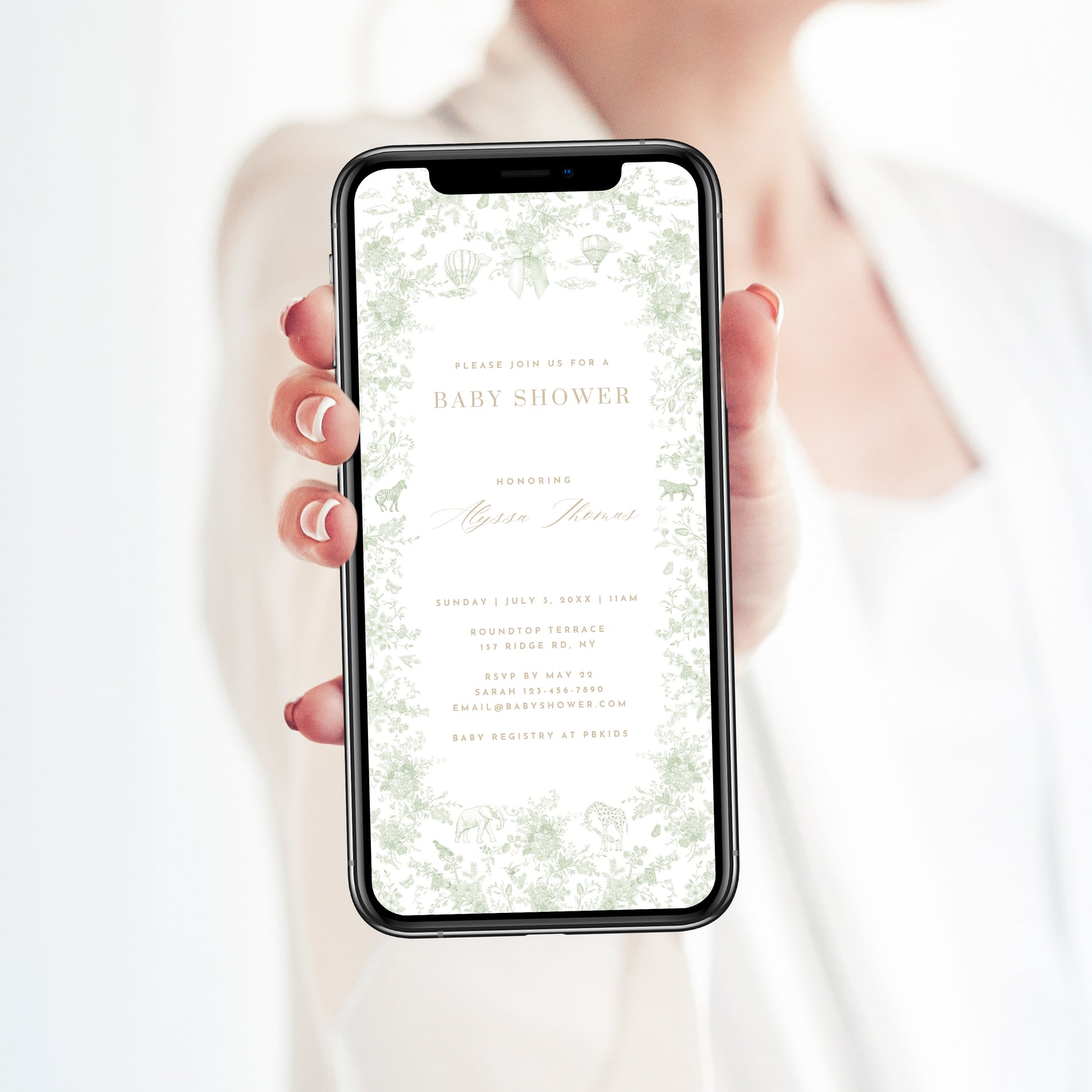 Person holding a smartphone with a baby shower invitation on the screen