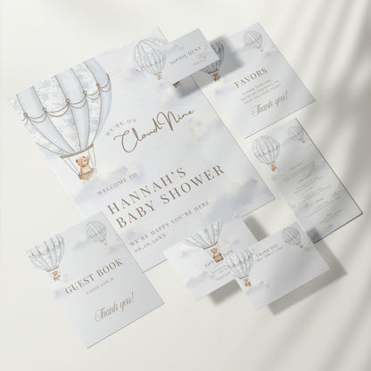 Baby shower invitation set with hot air balloon design on a white background