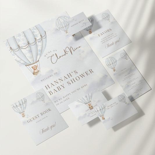 Baby shower invitation set with hot air balloon design on a white background