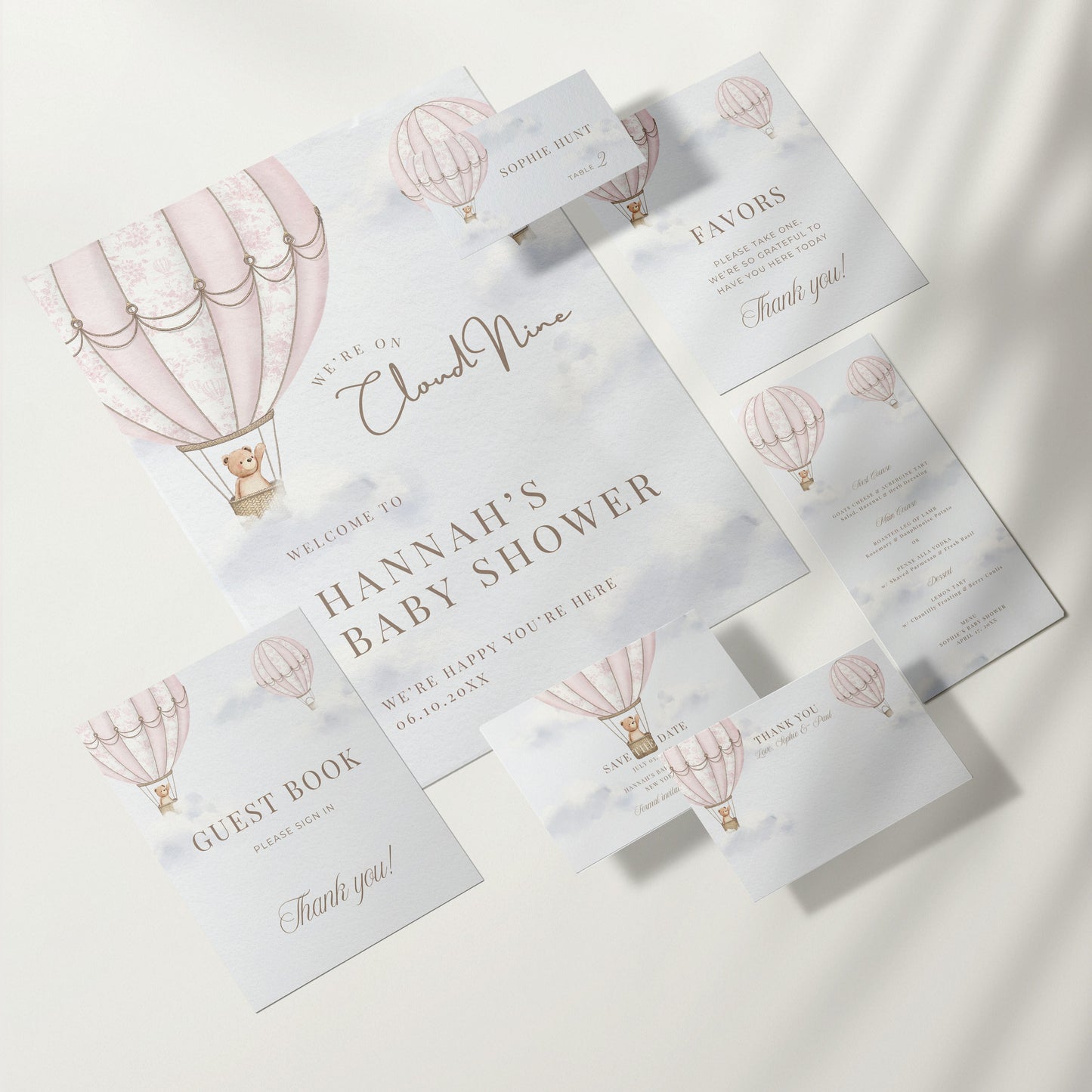 Baby shower invitation set with hot air balloon design on a white background