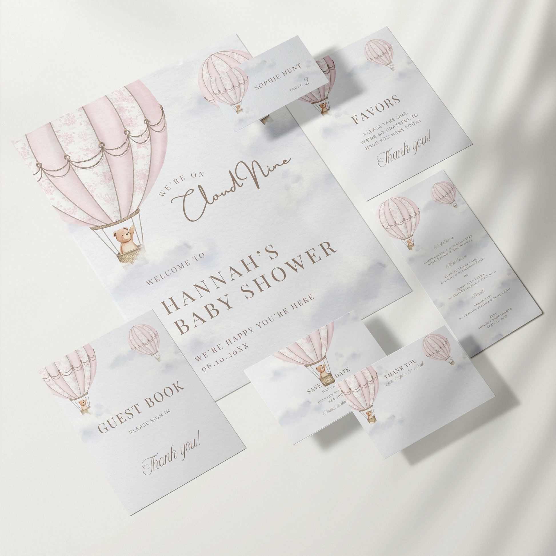 Baby shower invitation set with hot air balloon design on a white background