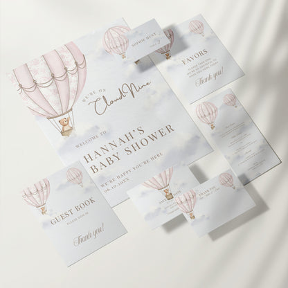 Baby shower invitation set with hot air balloon design on a white background