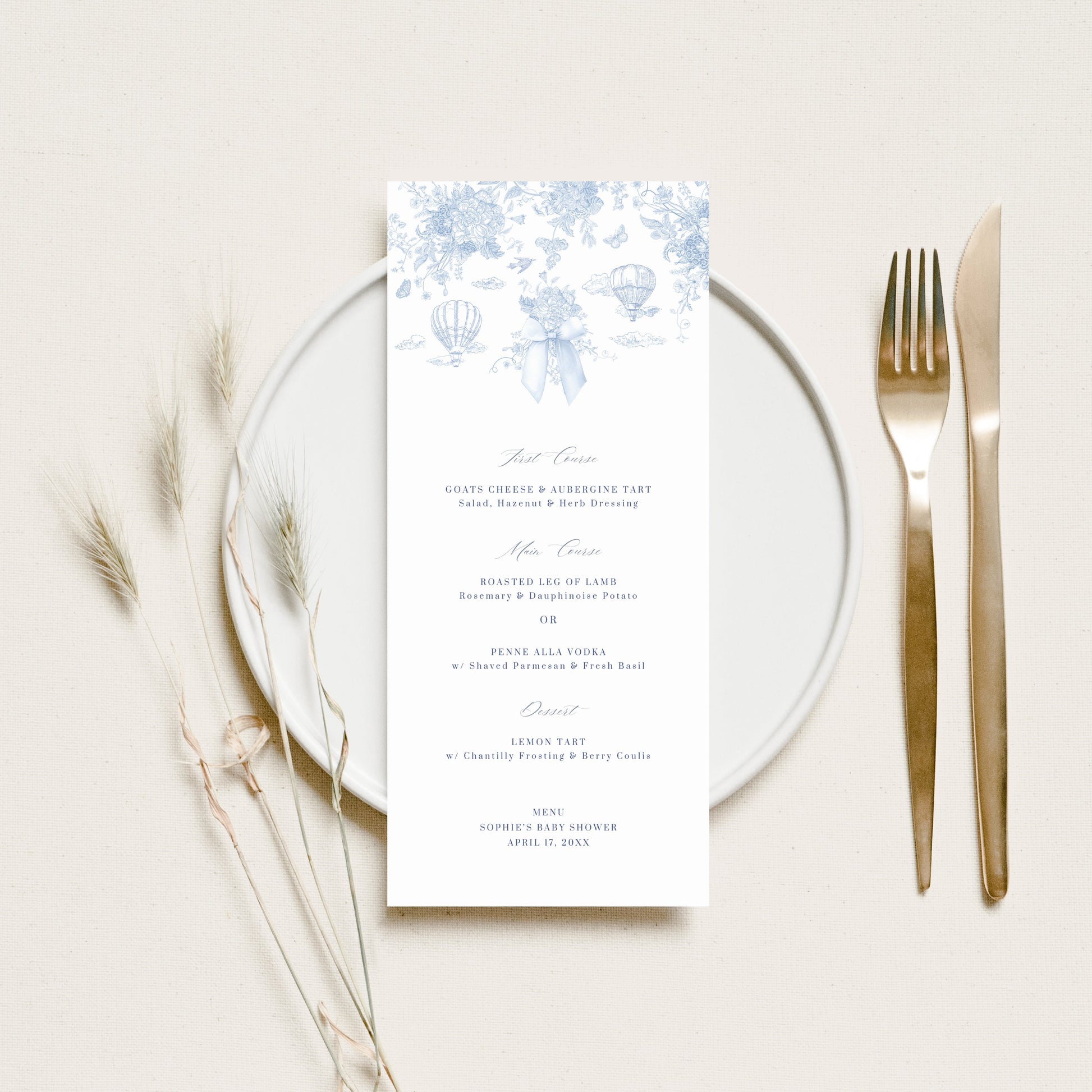 Menu card with floral design on a white plate with cutlery