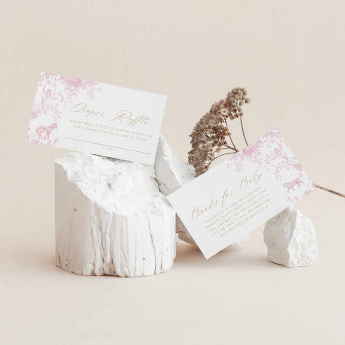 White stone-like boxes with floral designs and text on a beige background