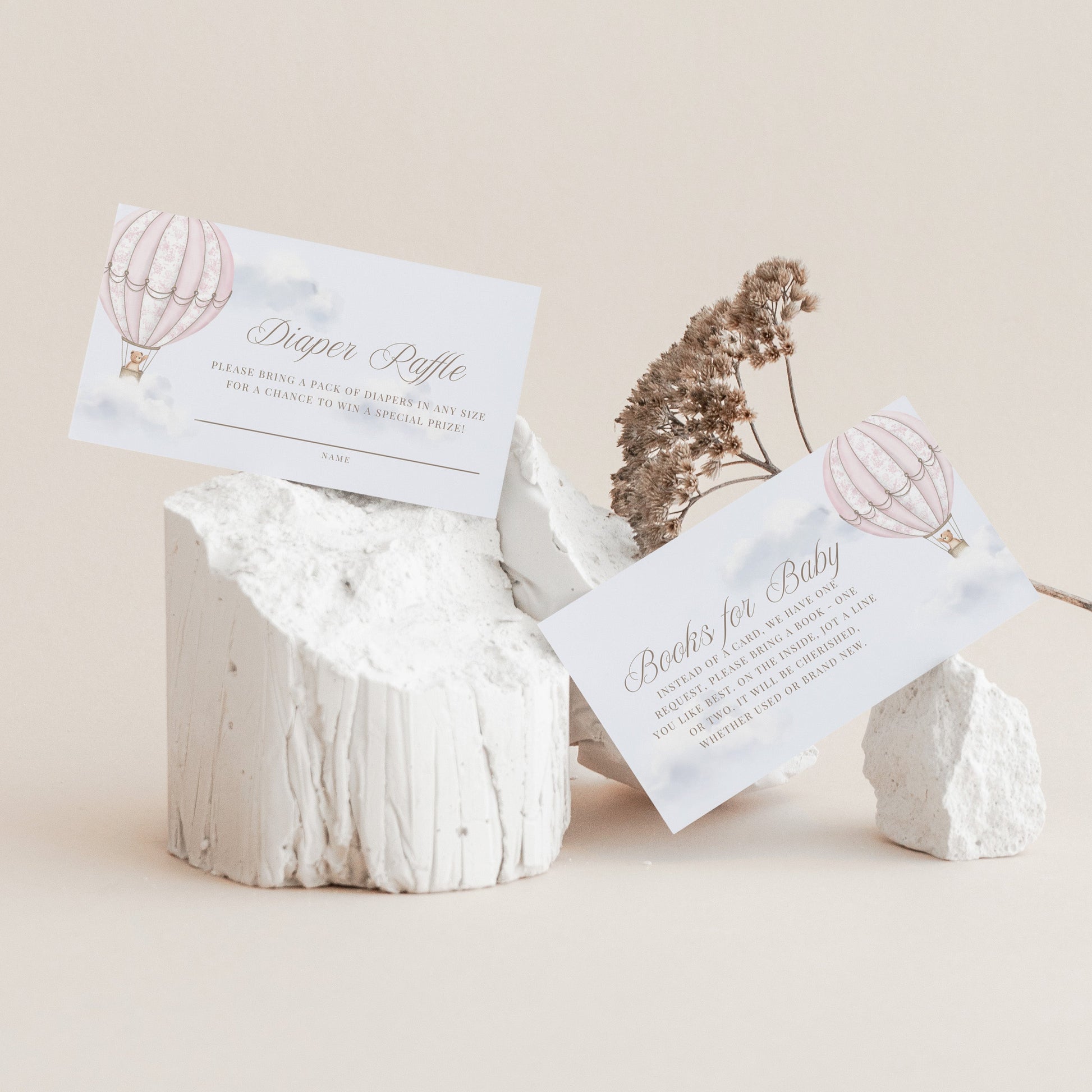 White stone holder with cards featuring hot air balloon designs on a beige background