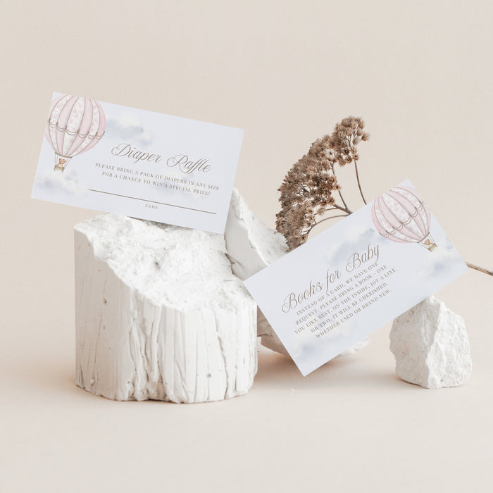 White stone holder with cards featuring hot air balloon designs on a beige background